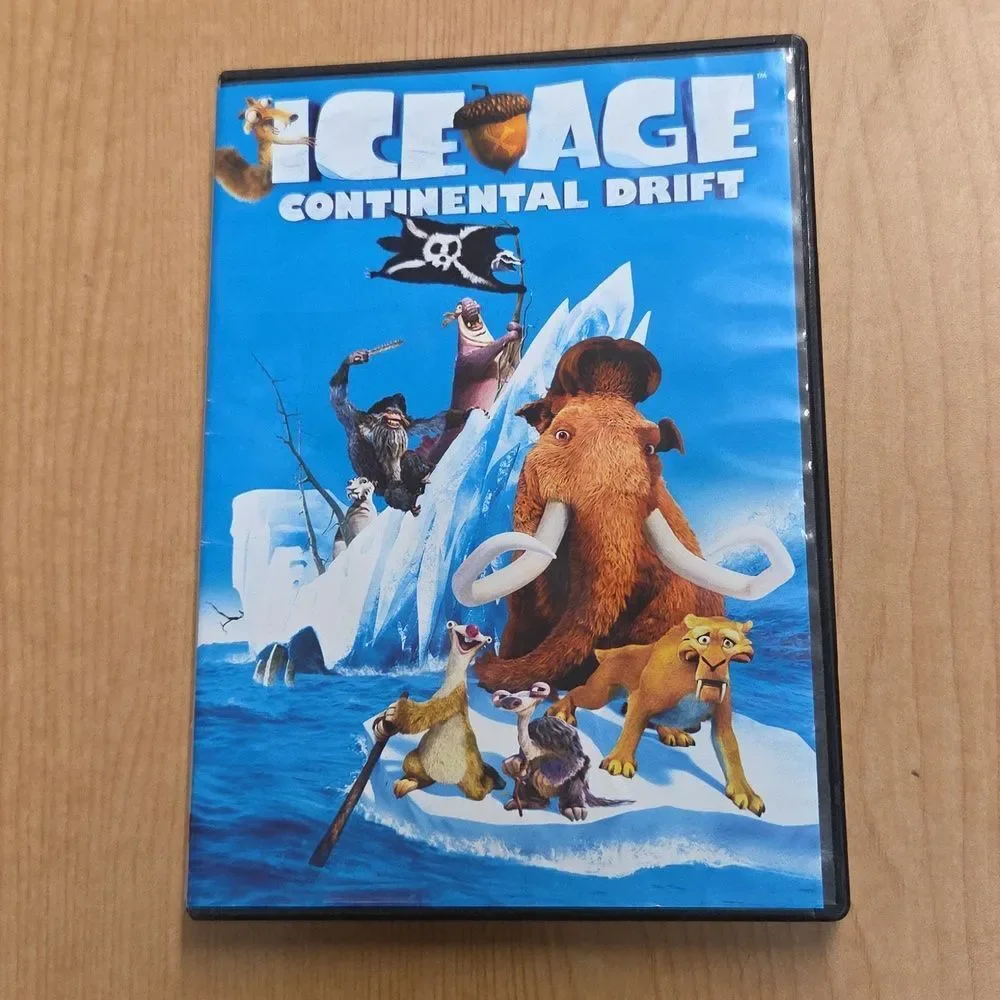 collection of Ice Age merchandise, including a VHS tape, two DVDs, Sid the Sloth